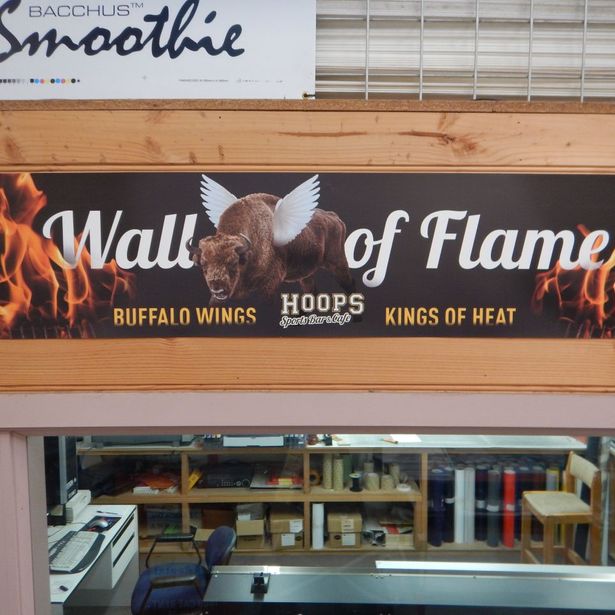 Newly printed store banner applied to the store window